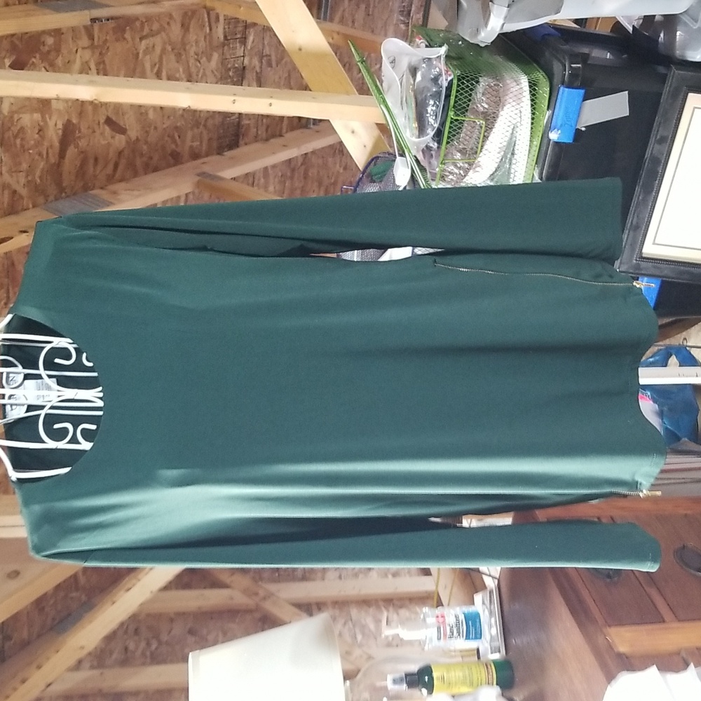 Hunter green Carmen pullover top with golden zipper detail on side. Size large
